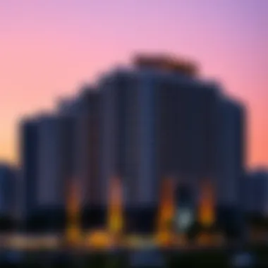 Narcissus Building at dusk with city lights illuminating its façade